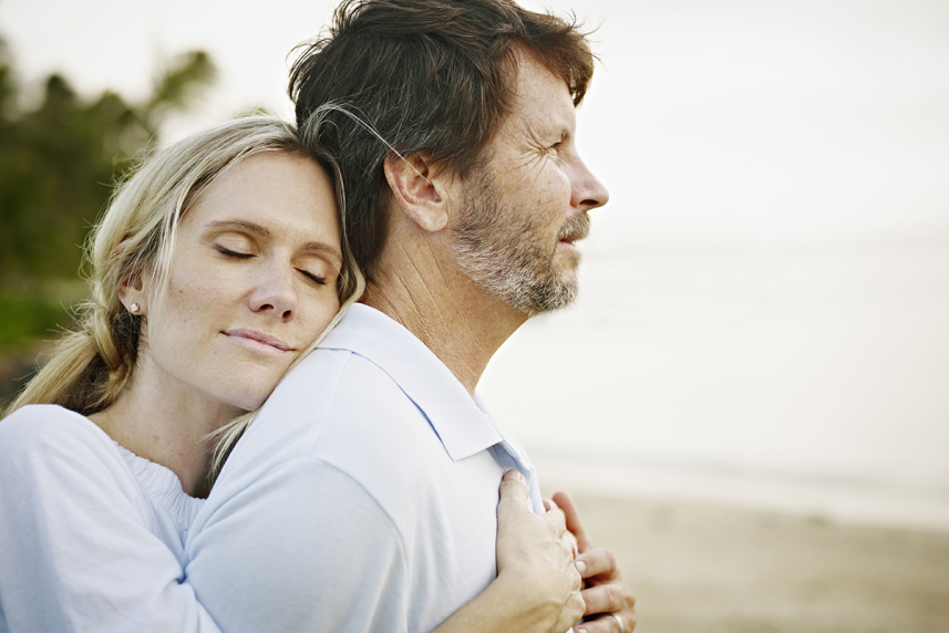 Woman hugging man